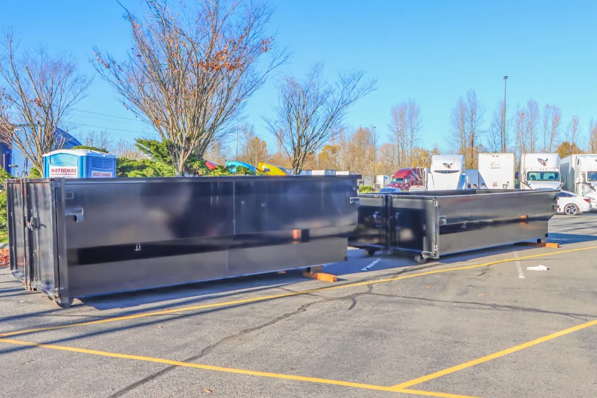 Professional dumpster rental service with roll-off container on residential driveway in Brecksville